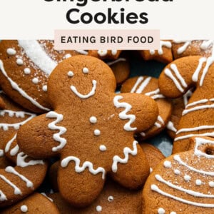Close up photo of Gingerbread Cookies, including a cute gingerbread man, decorated with white frosting.