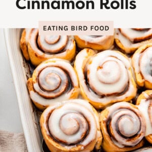 Pan of cinnamon rolls with a spatula under one.