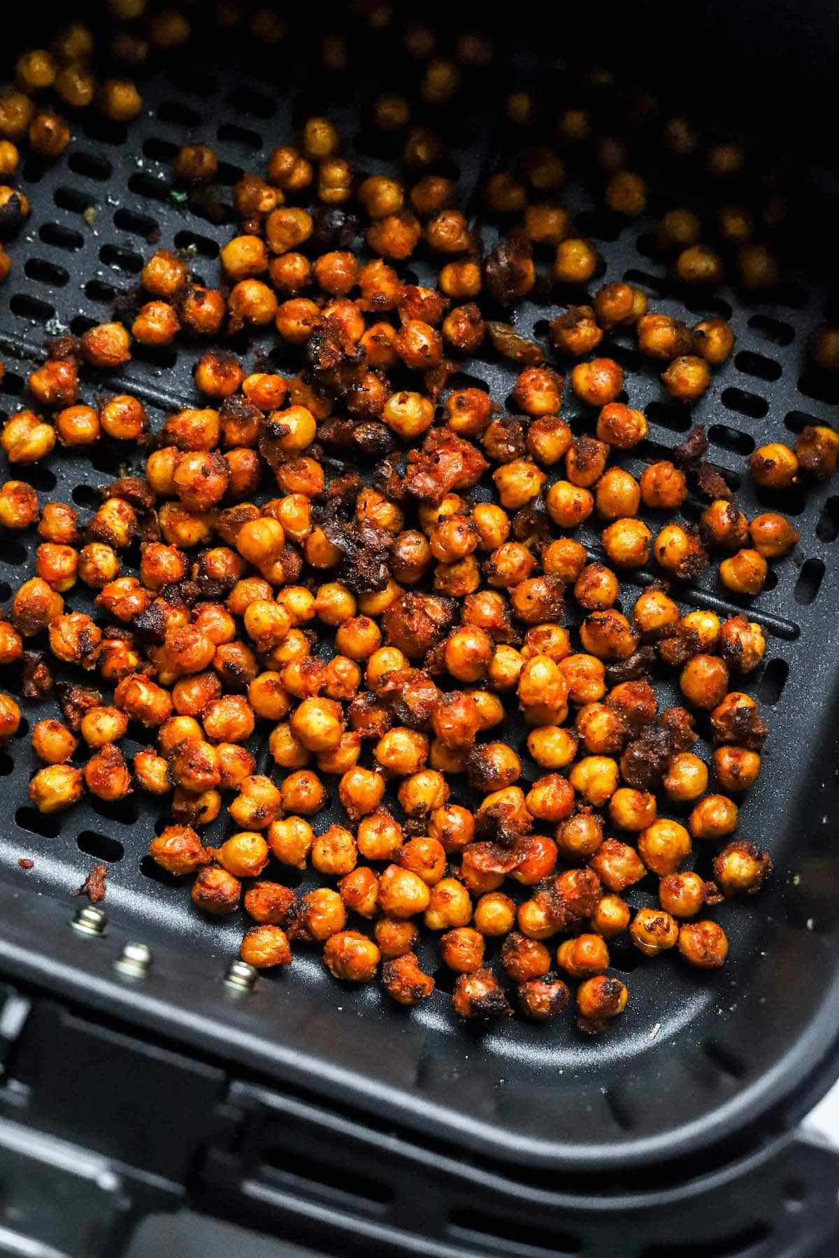 Chili Lime chickpeas in an air fryer basket.