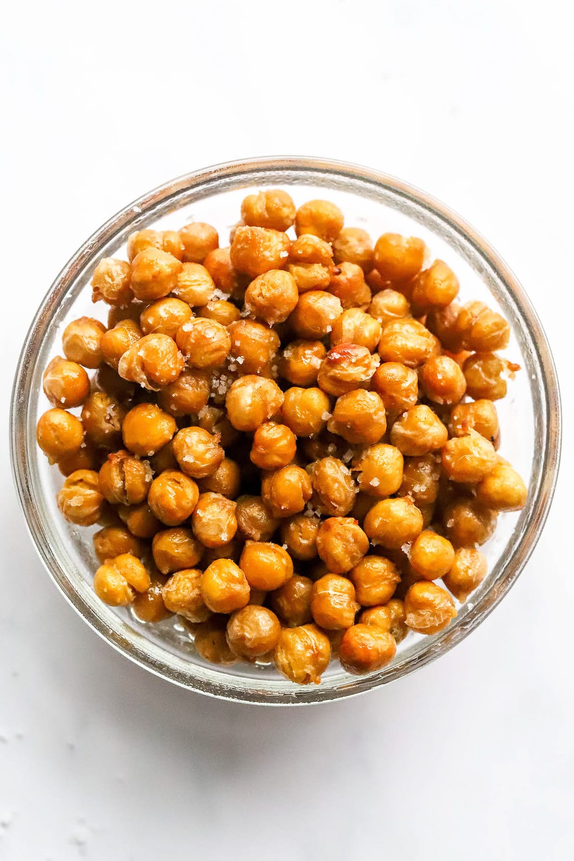 Salted air fried chickpeas in a glass bowl.