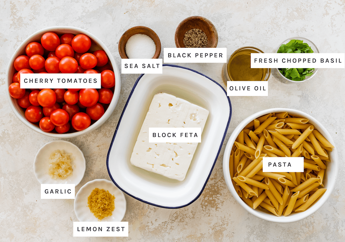 Cherry tomatoes, block feta, pasta, olive oil, garlic, lemon zest, sea salt, black pepper, fresh chopped basil