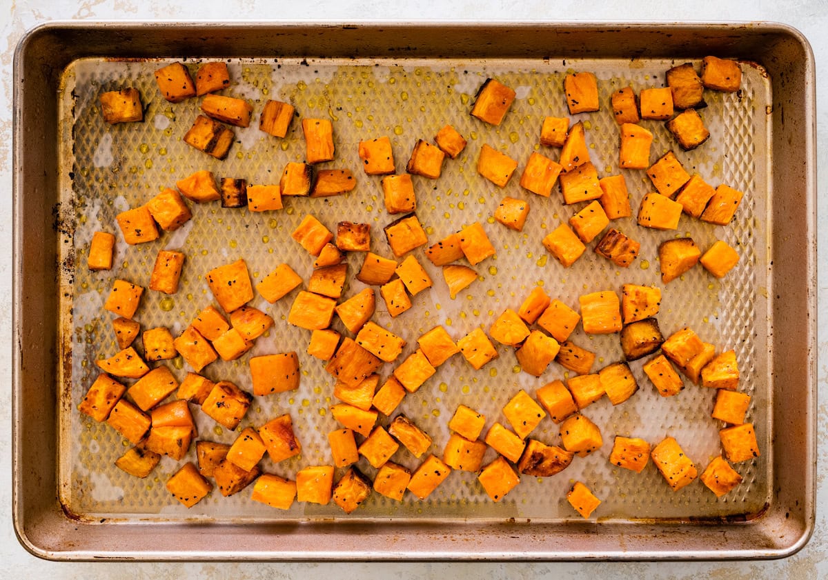 Roasted sweet potatoes on a baking sheet.