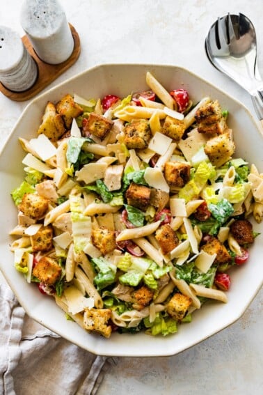 Chicken caesar pasta salad in a large bowl.