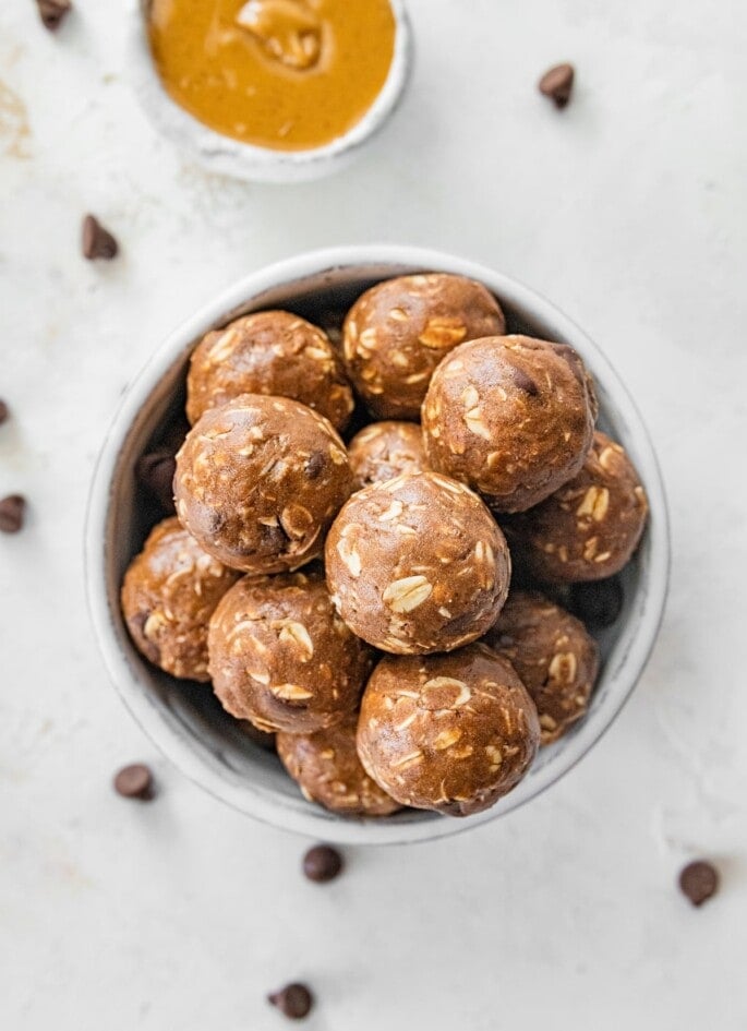 Chocolate peanut butter protein balls in a bowl.