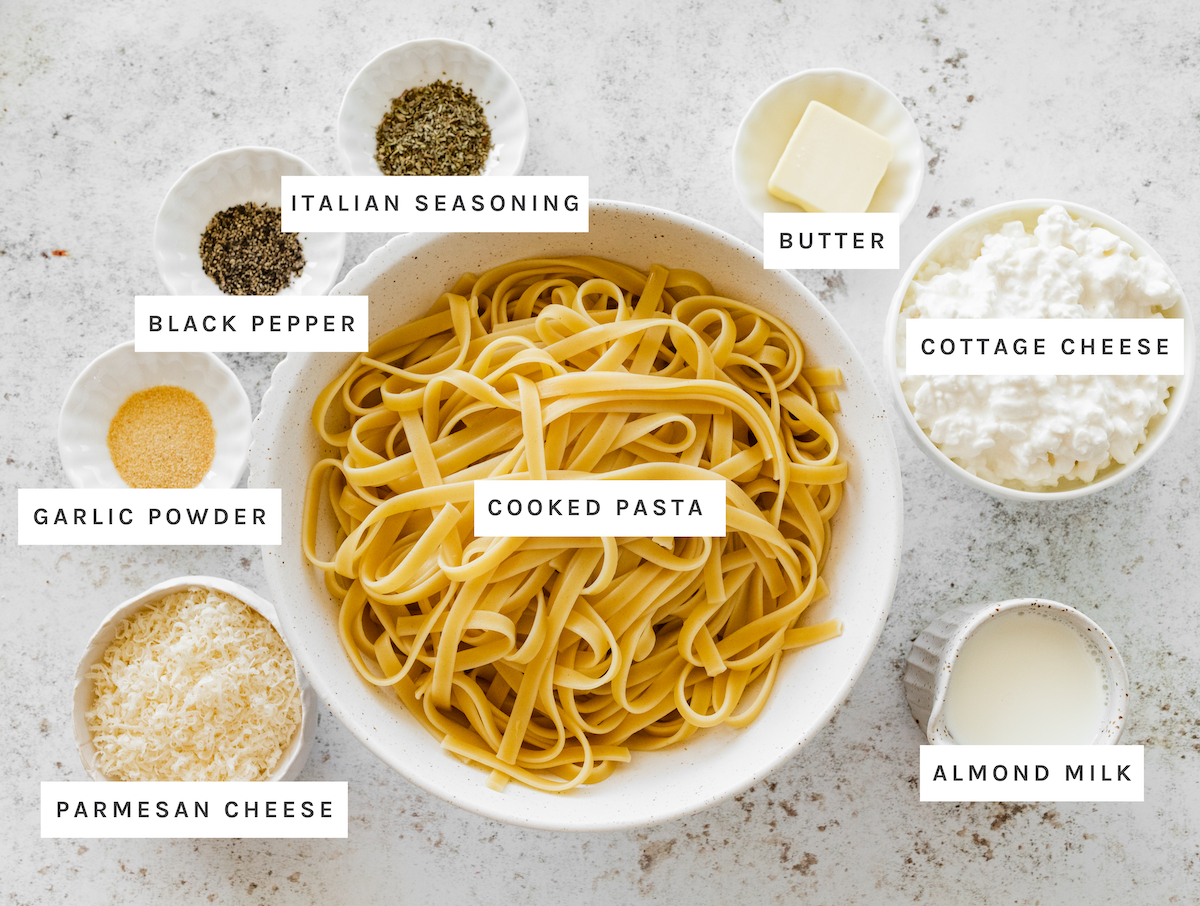 Cooked pasta, cottage cheese, almond milk, butter, parmesan cheese, garlic powder, black pepper, Italian seasoning
