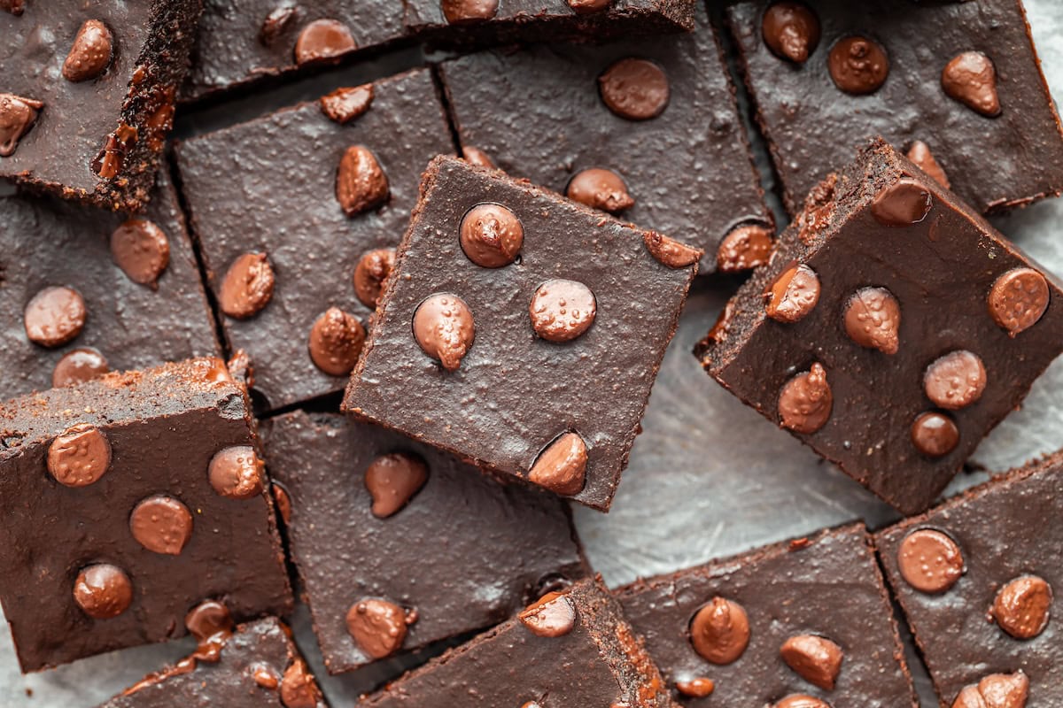 Gooey cottage cheese brownies cut into squares with melty chocolate chips.