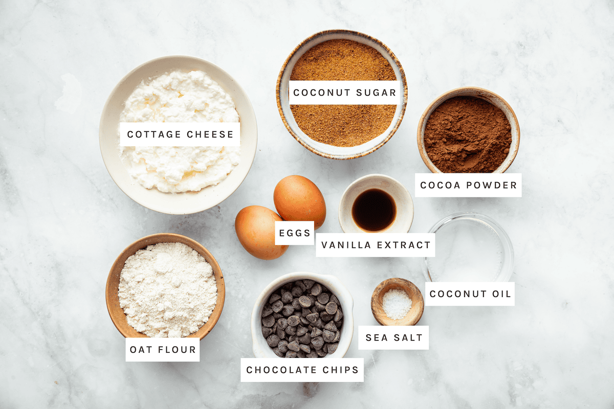 Cottage Cheese Brownies ingredients: Cottage cheese, coconut sugar, cocoa powder, eggs, vanilla extract, coconut oil, oat flour, sea salt, chocolate chips