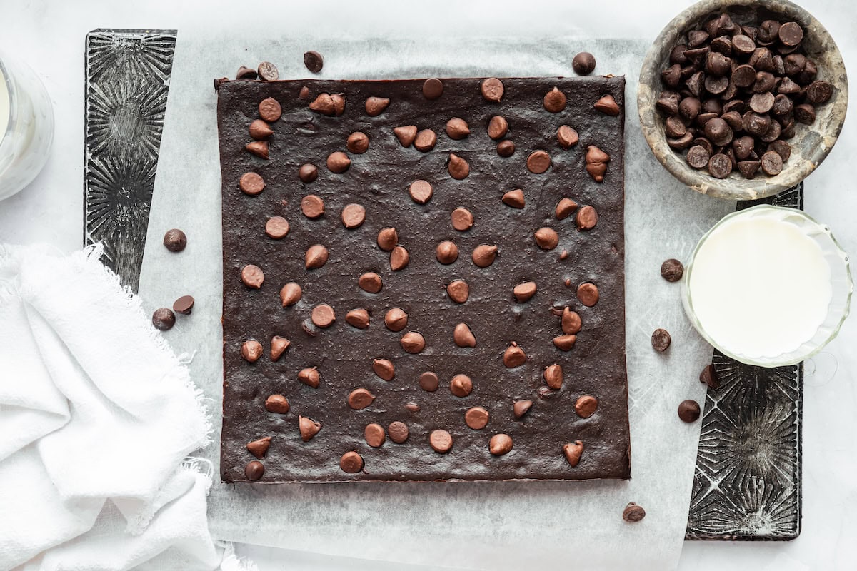 Freshly baked cottage cheese protein brownies on parchment paper.