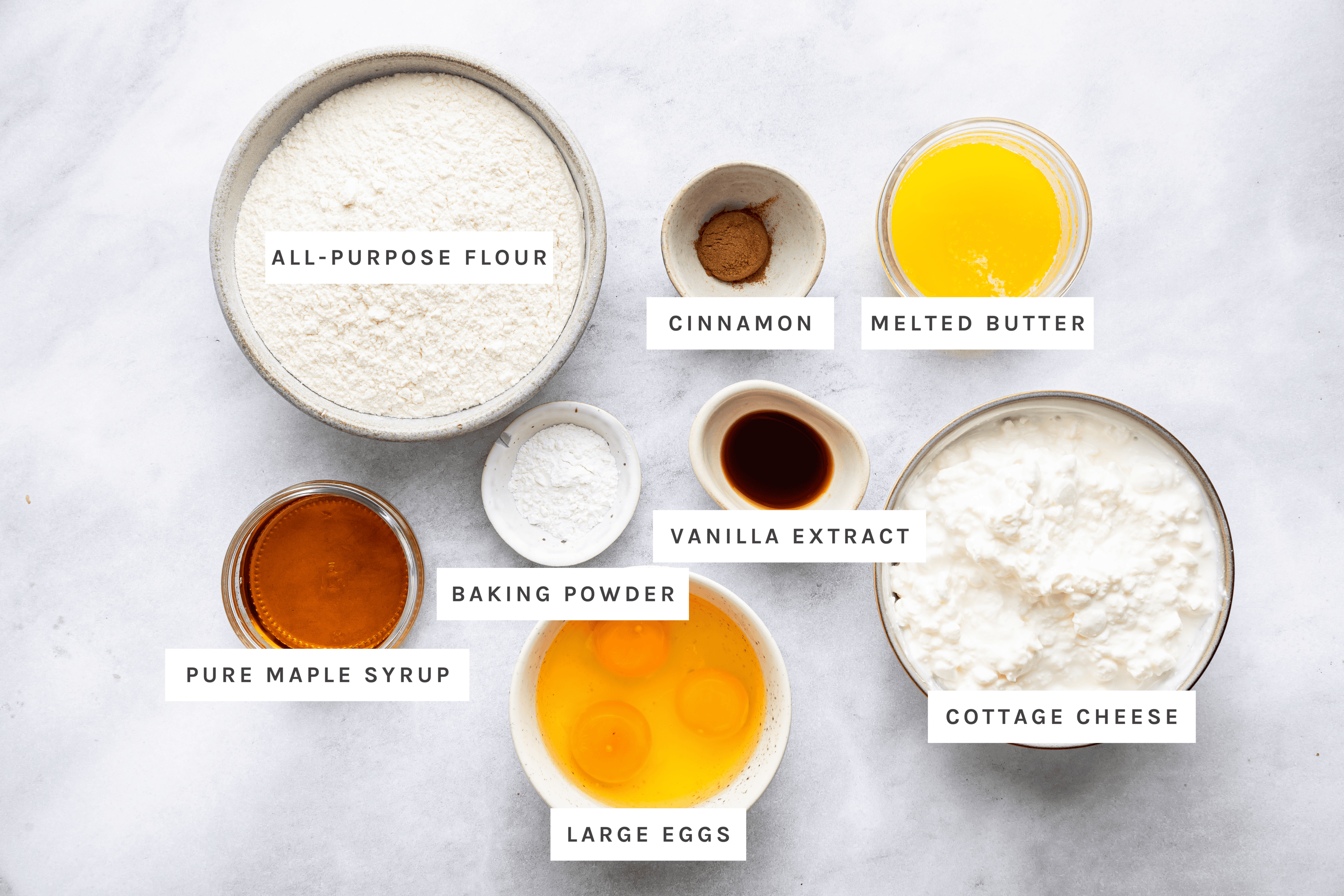 Cottage Cheese Waffles ingredients: All-purpose flour, cinnamon, melted butter, pure maple syrup, baking powder, vanilla extract, cottage cheese, large eggs