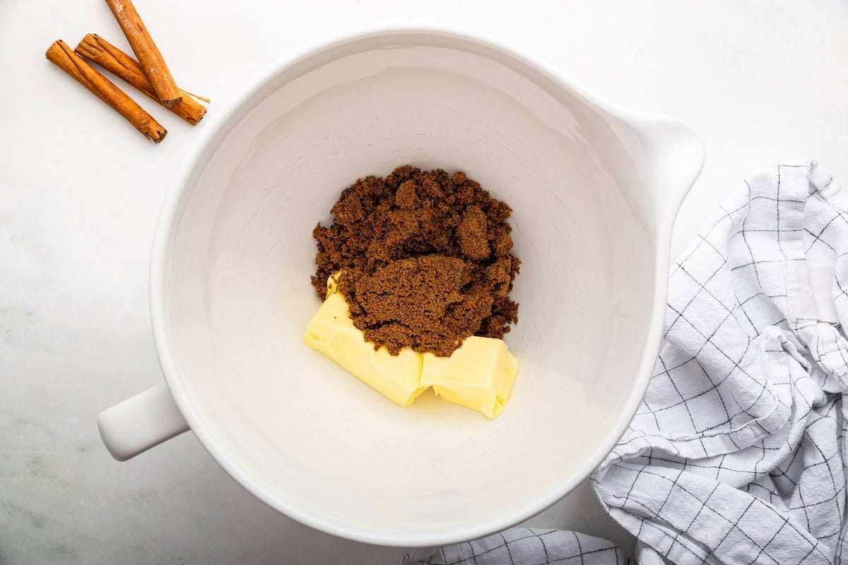 A large mixing bowl of sugar and butter used for gingerbread cookies.