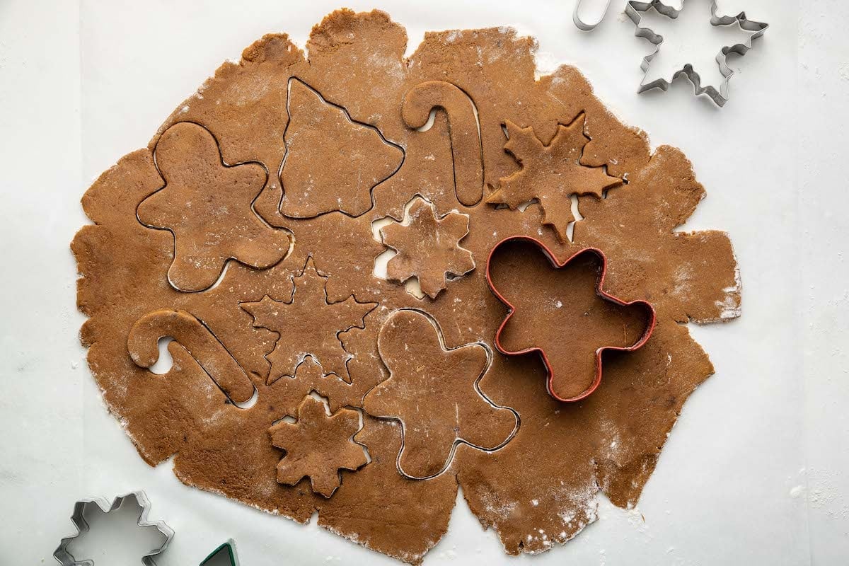 Cookie cutters used to make gingerbread cookies out of the flattened cookie dough.