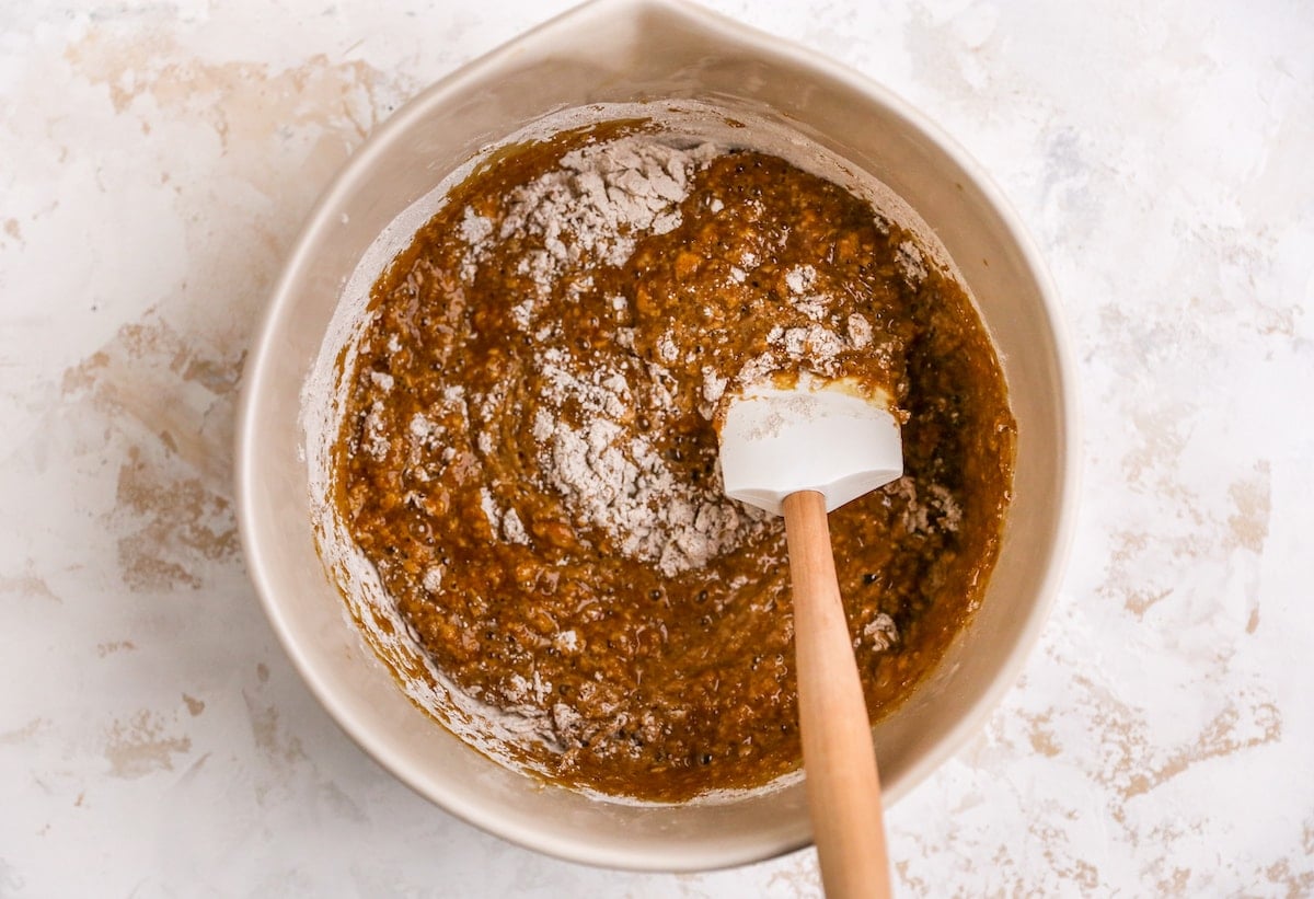 Ingredients for gingerbread loaf being mixed together with a spatula.