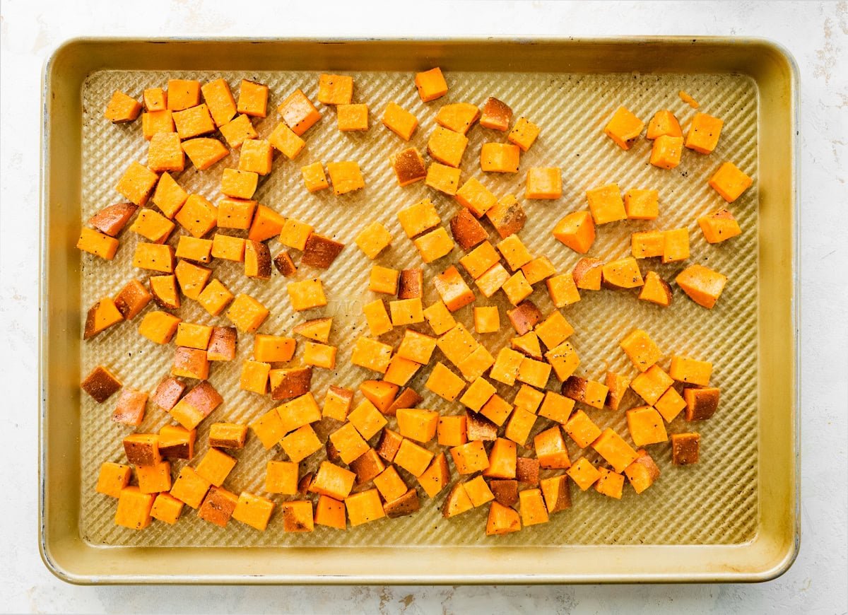 Roasted sweet potatoes on a baking sheet.