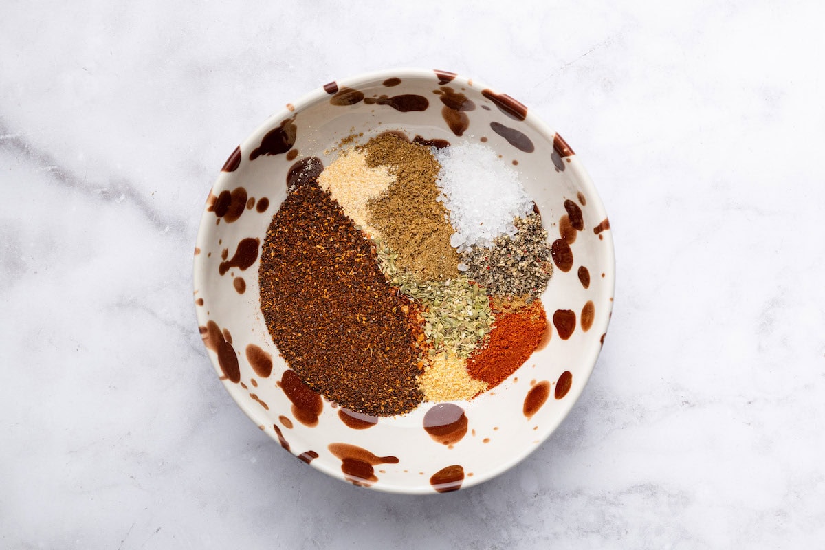 All the seasonings for a homemade taco mix in a small bowl.