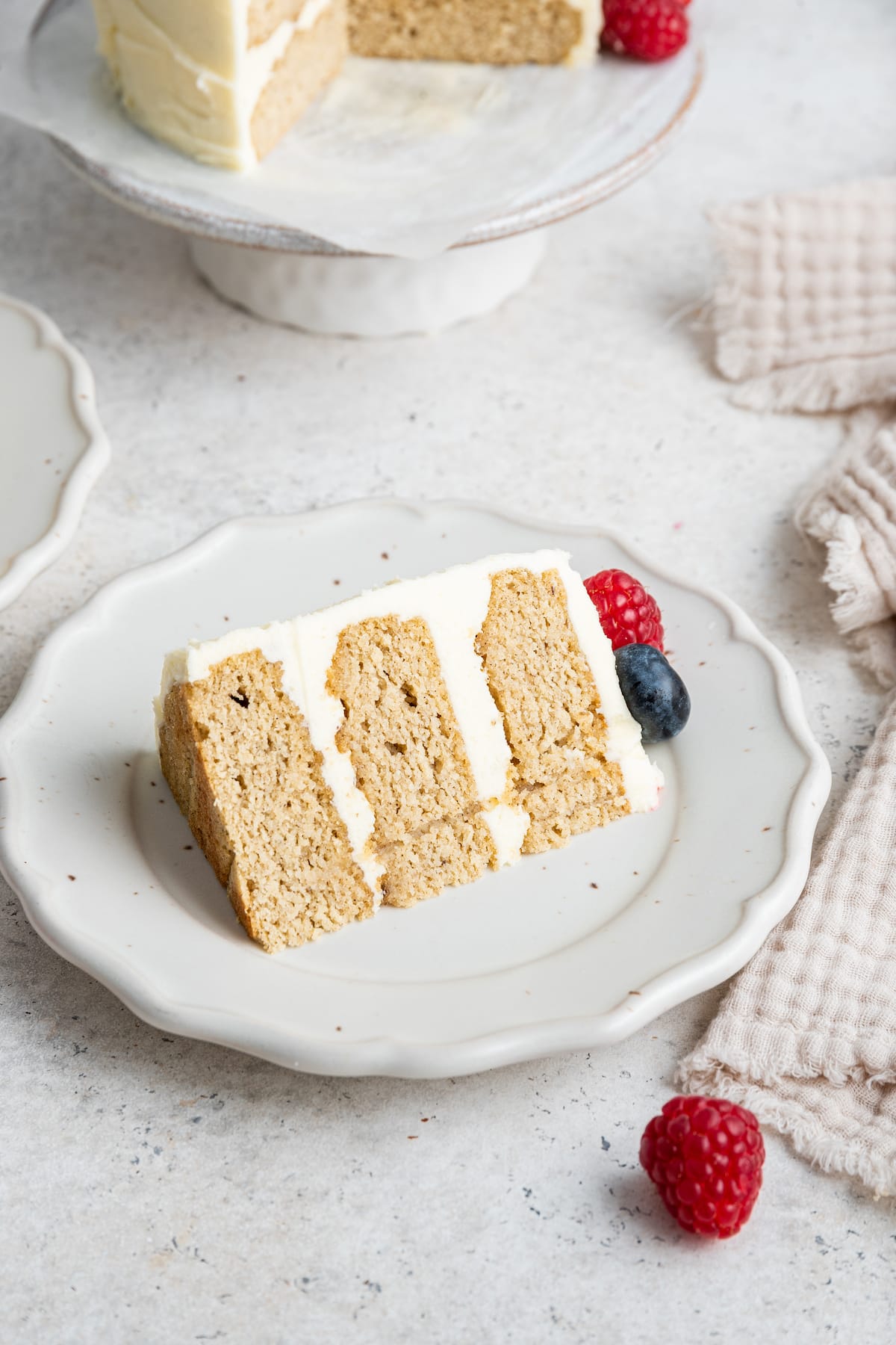 One smash cake slice being served on a white plate.