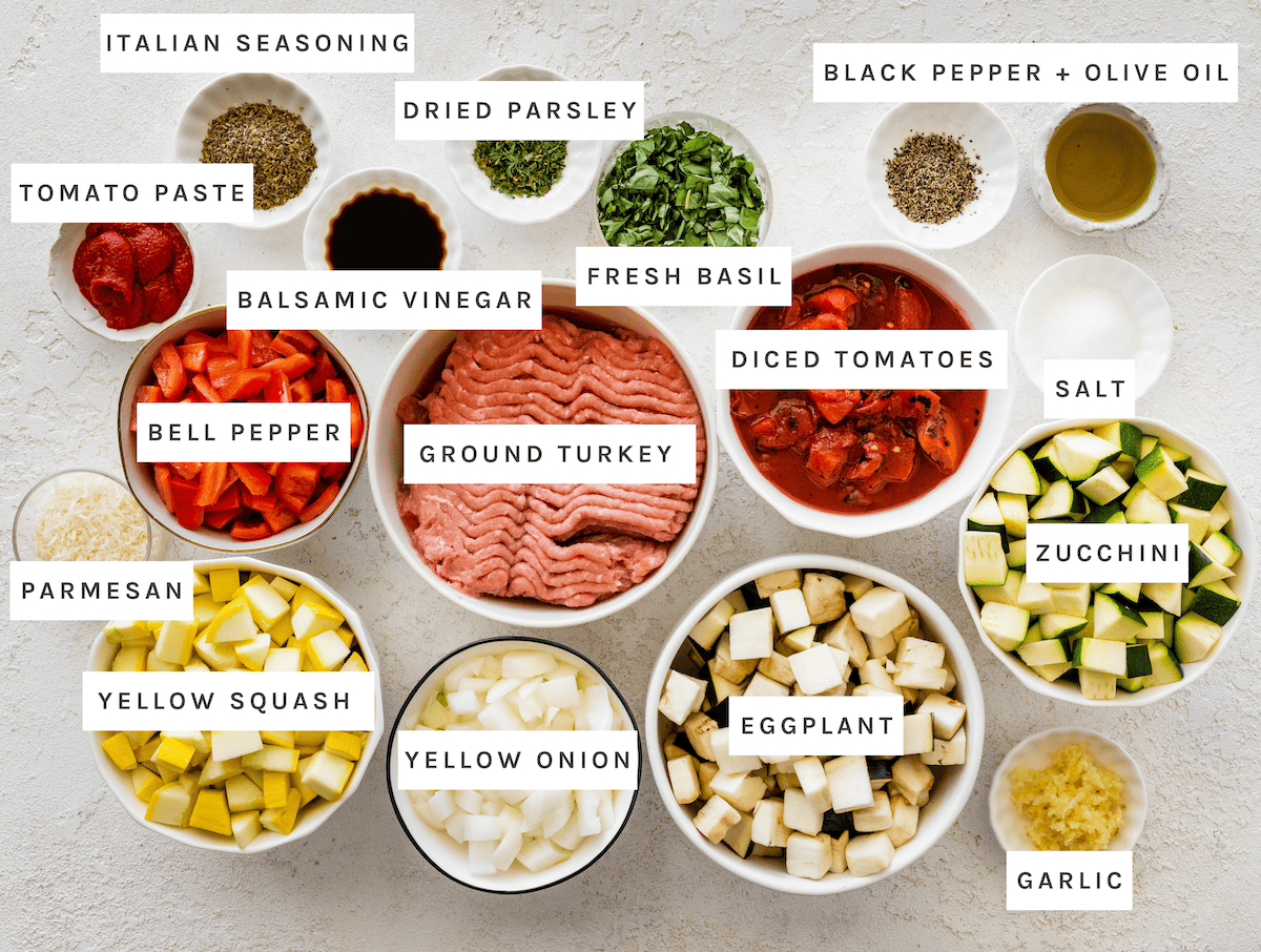 Italian seasoning, dried parsley, black pepper, olive oil, tomato paste, balsamic vinegar, fresh basil, diced tomatoes, salt, bell pepper, ground turkey, zucchini, parmesan, yellow squash, yellow onion, eggplant, garlic