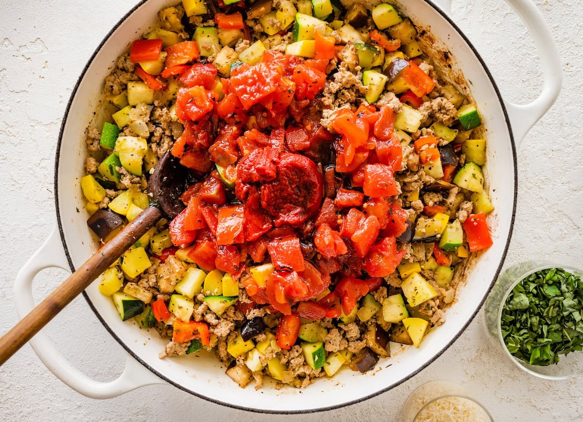 Ground turkey skillet with diced tomatoes and tomato paste added to sautéed vegetables.