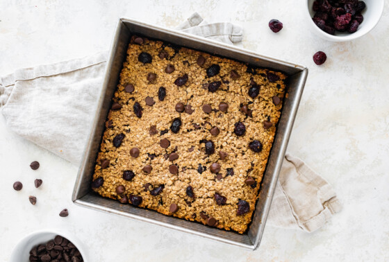 Oatmeal breakfast bars after being baked in the oven in a square baking pan.