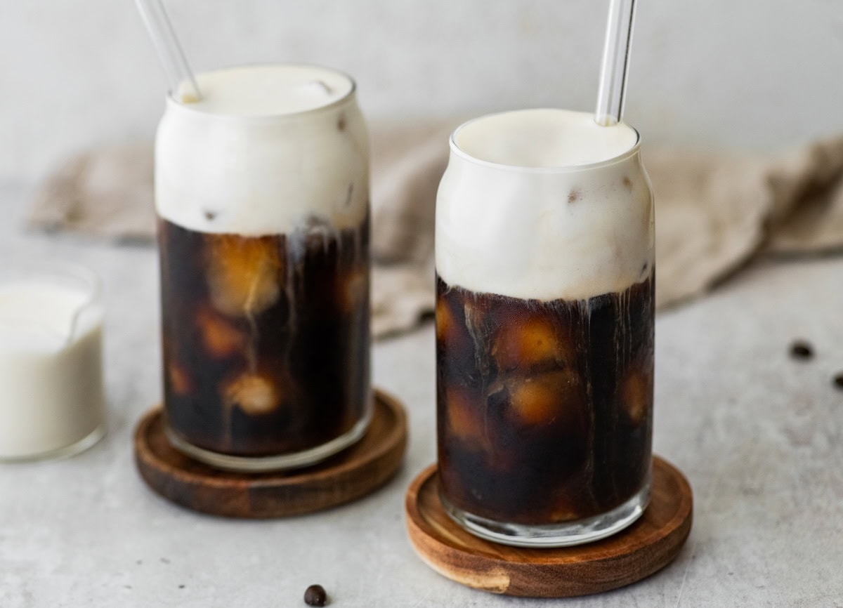 Homemade protein cold foam floating on top of cold brew coffee.