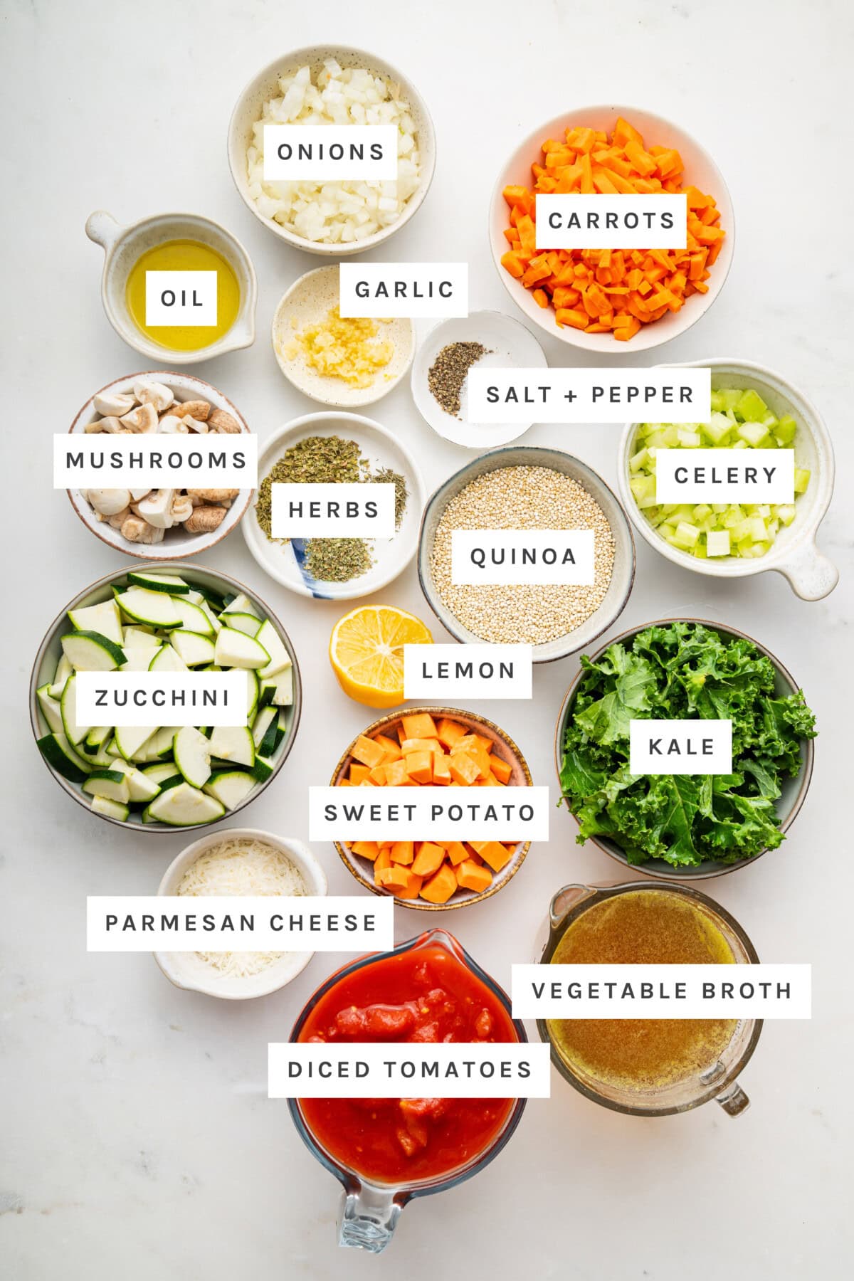 Ingredients to make Quinoa Vegetable Soup. Olive Oil, Onions, Carrots, Diced Tomatoes, Vegetable Broth, Parmesan Cheese, Sweet Potato, Kale, Zucchini, Mushrooms, Celery, Garlic, Quinoa, Salt and Pepper, Herbs, Lemon