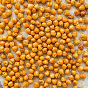Crispy oven roasted chickpeas showing golden, crunchy texture.