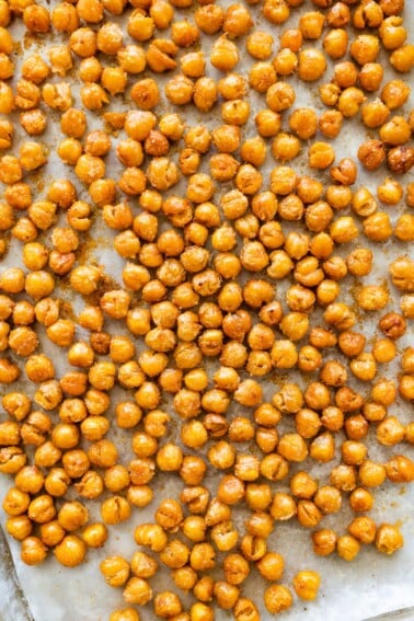 Crispy oven roasted chickpeas showing golden, crunchy texture.
