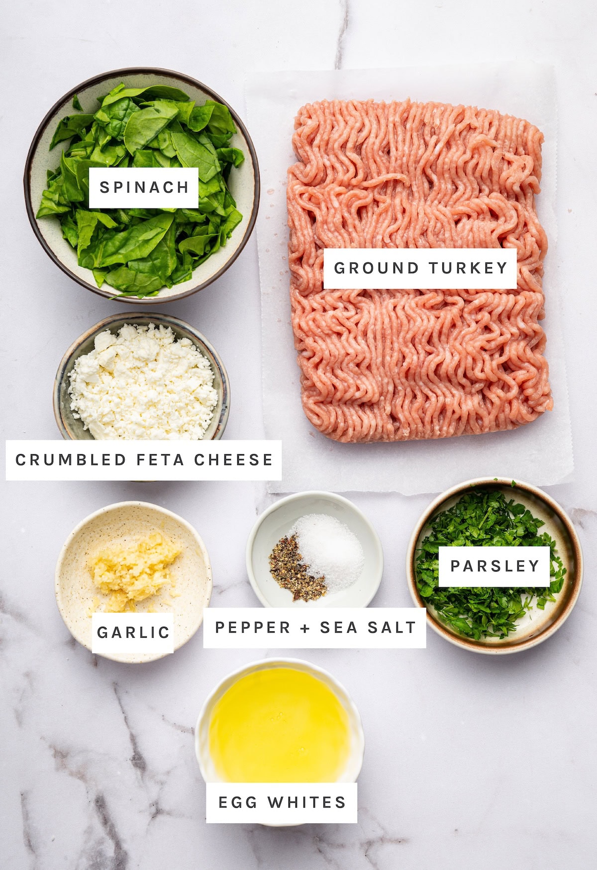 Spinach and Feta Turkey Burgers ingredients: Spinach, ground turkey, crumbled feta cheese, garlic, pepper, sea salt, parsley, egg whites.