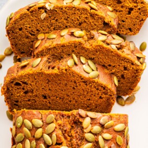 Sliced homemade Starbucks pumpkin bread showing moist texture and pumpkin spice crumb.