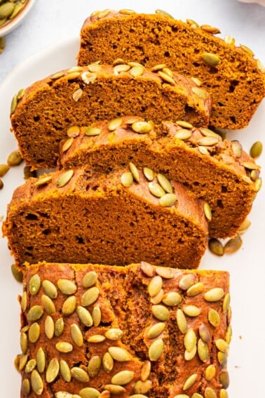Sliced homemade Starbucks pumpkin bread showing moist texture and pumpkin spice crumb.
