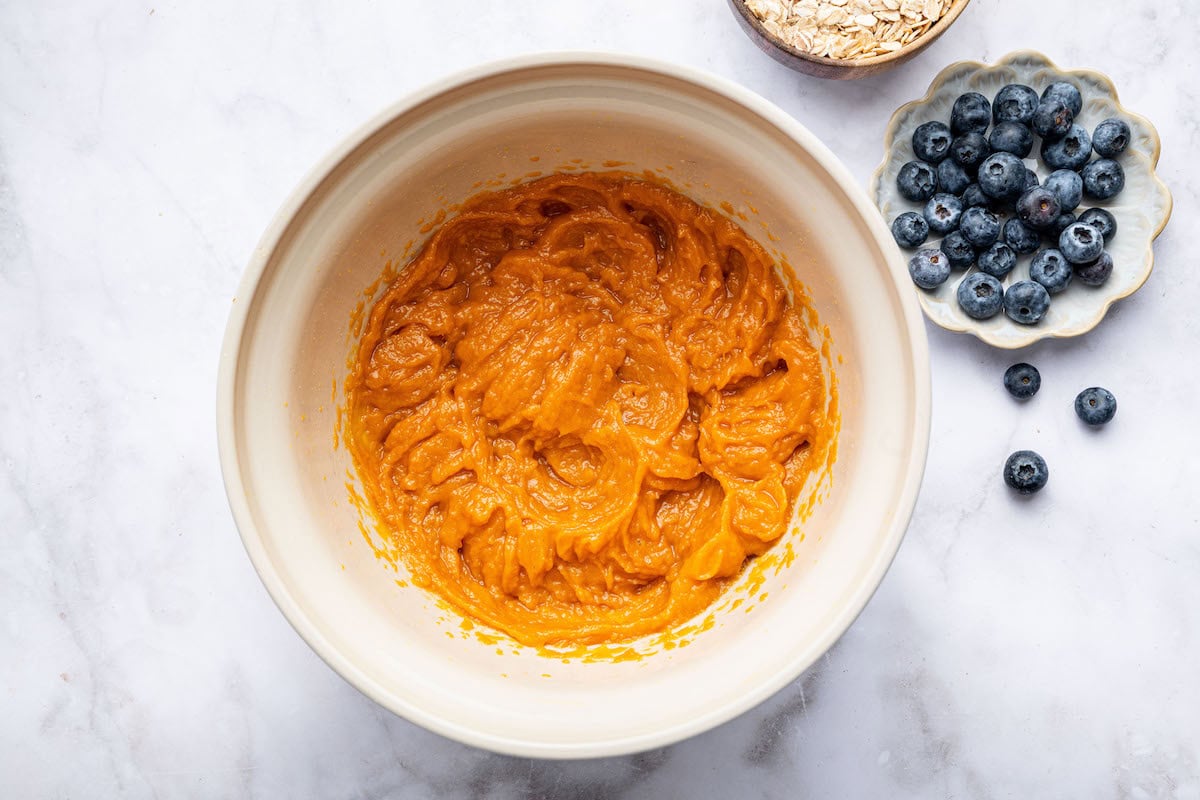 The wet ingredients for the sweet potato blueberry oatmeal cookies mixed together in a mixing bowl.